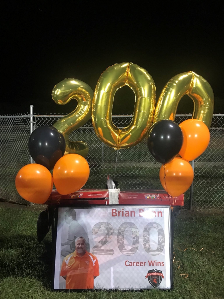 200 balloons with cookie cake on a table