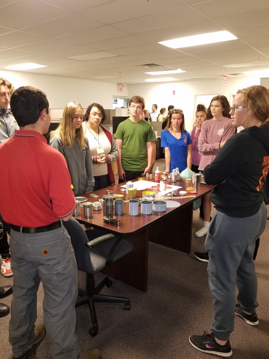 people gathered around a table lecture