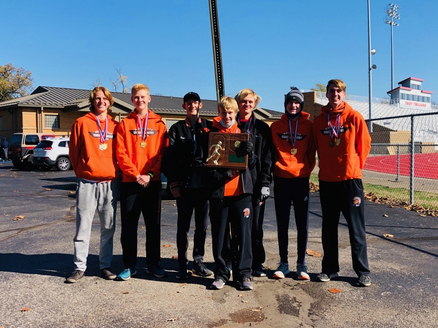 Boys smiling with trophies