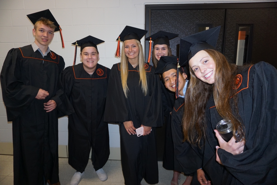 graduates smiling