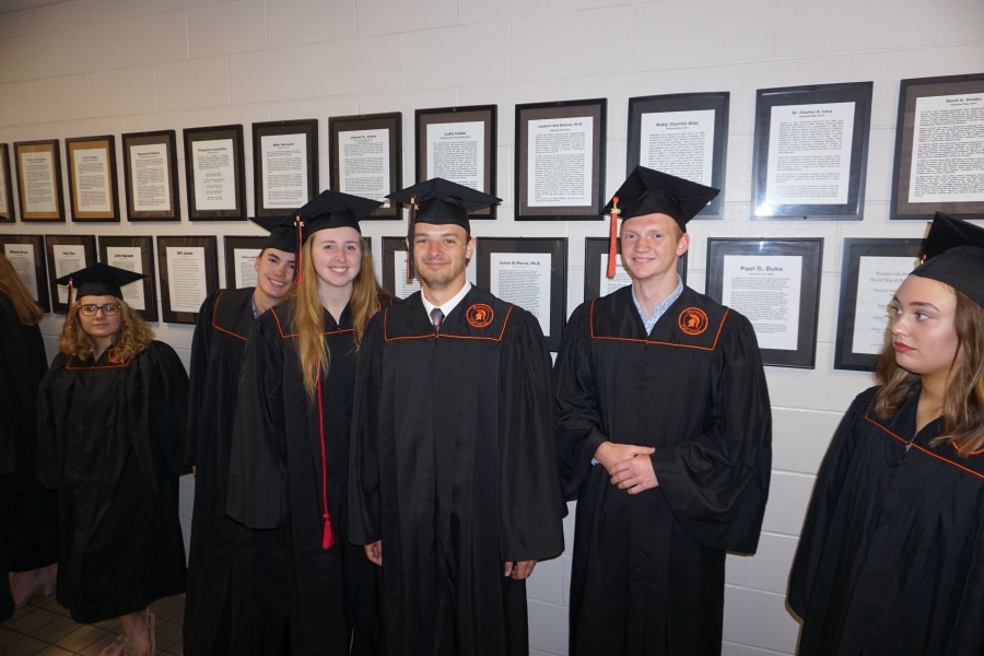 graduates smiling