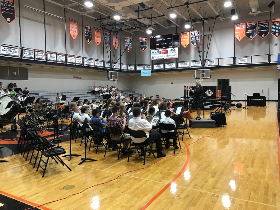 students seated that are performing in a concert