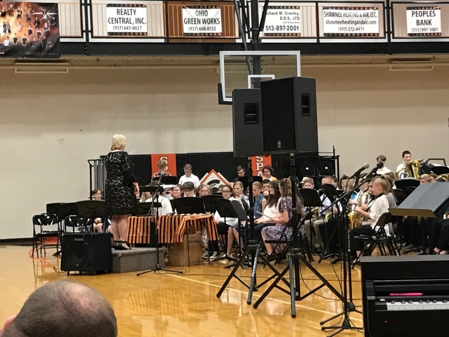 students seated that are performing in a concert