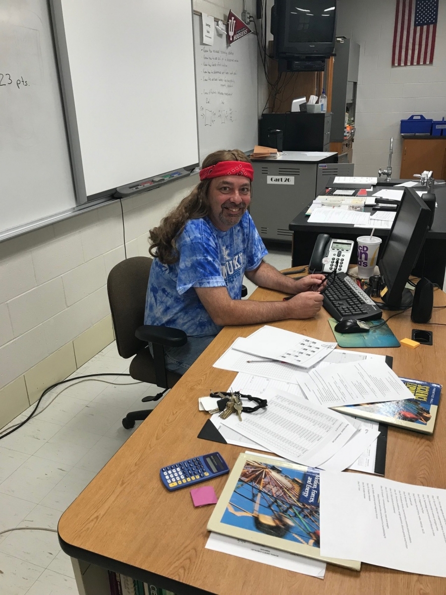 guy wearing long hair wig and bandana