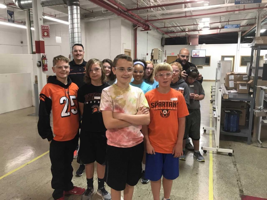 students on a tour of a manufacturing plant