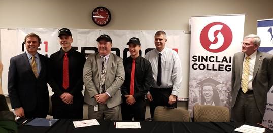 6 people wearing ties and smiling for a photo