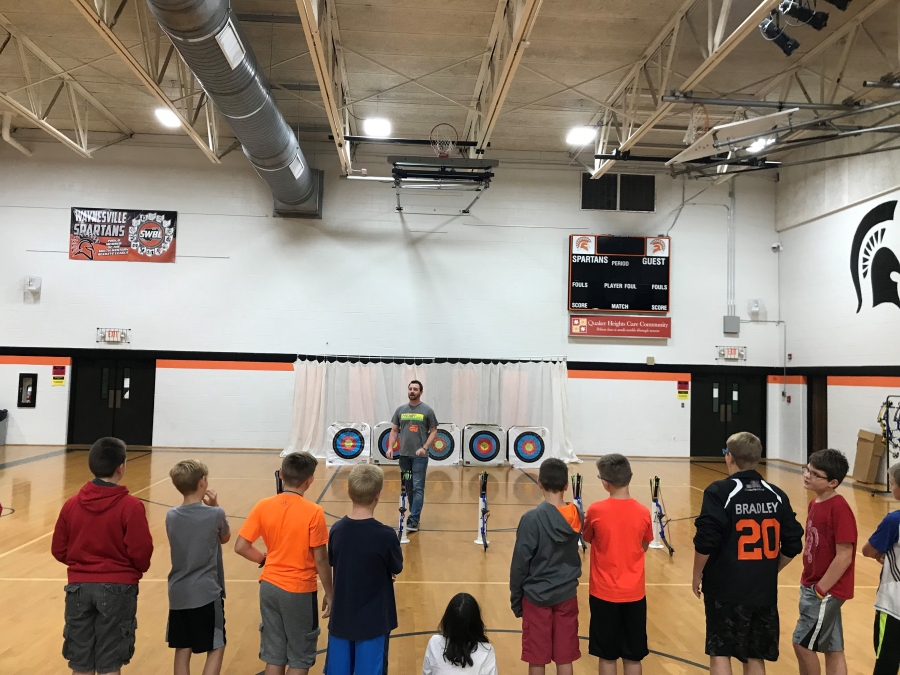 man in front of archery targets