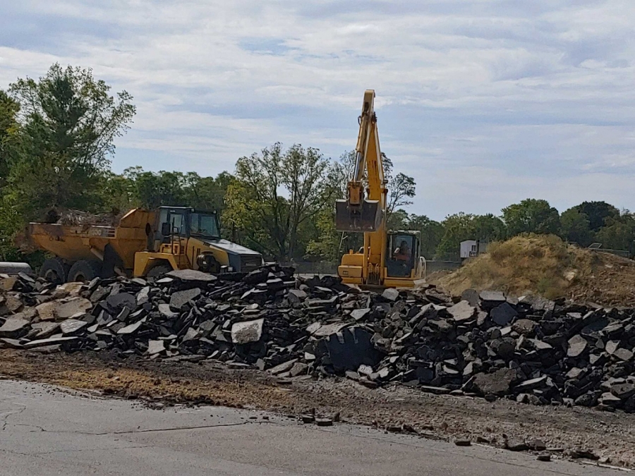 bull dozer and a pile of rubble