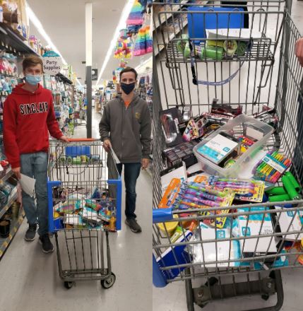 two boys with a grocery cart