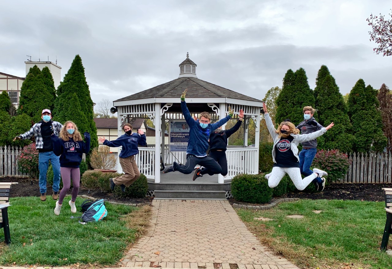 group of people jumping into the air