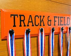 medals hanging on a peg board