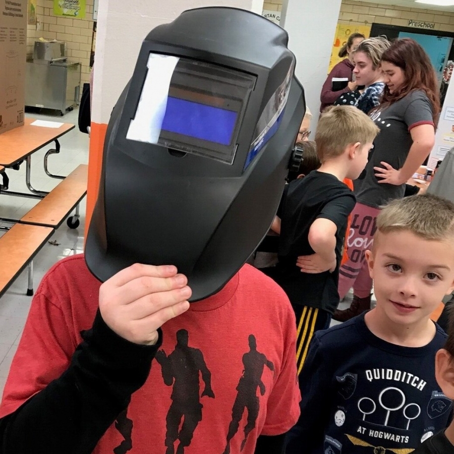 boy in a welding hat