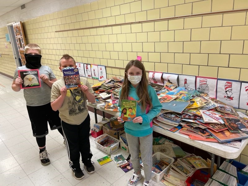 kids with books on a table