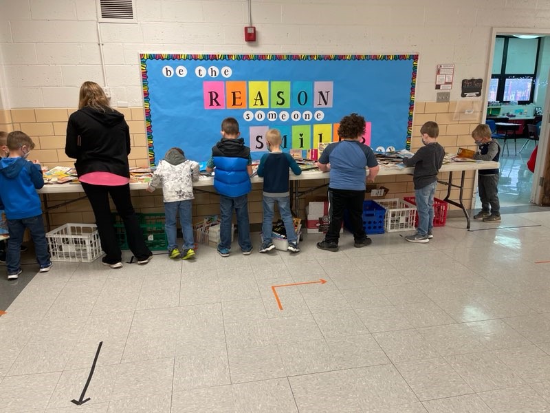 kids with books on a table