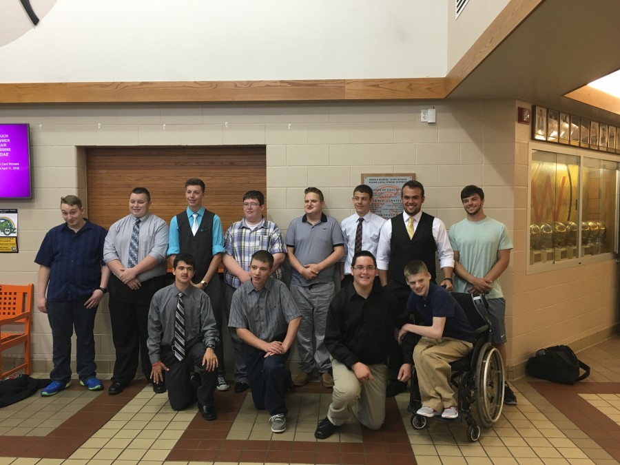 group of boys all smiling for a photo