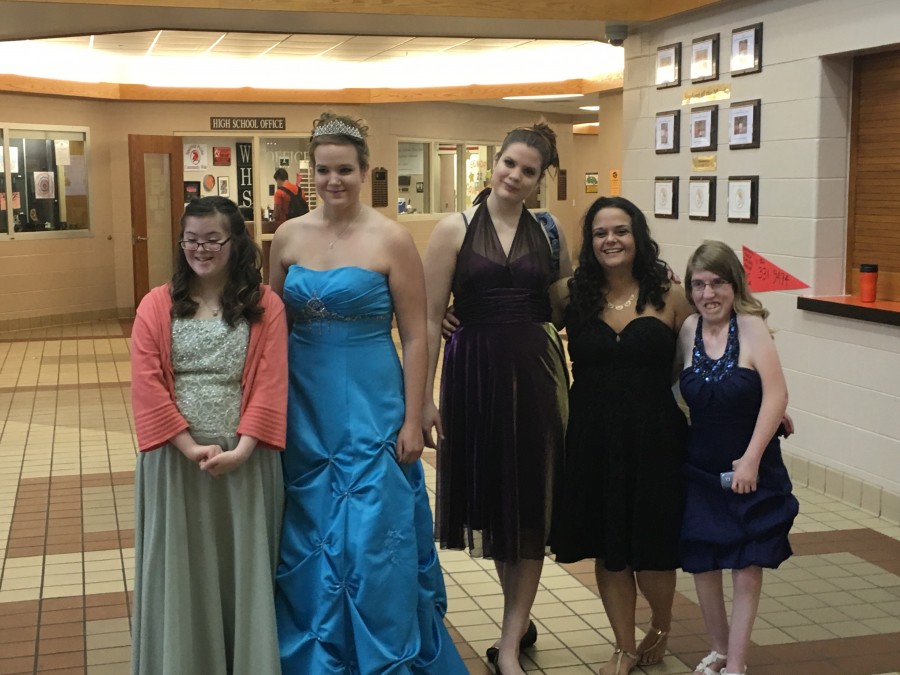 girls all smiling and wearing dresses