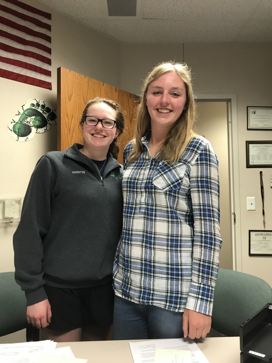 image of two girls with arms around each other