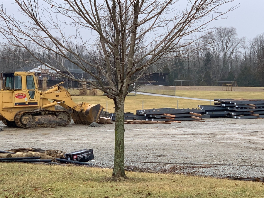 large yellow equipment with a tree