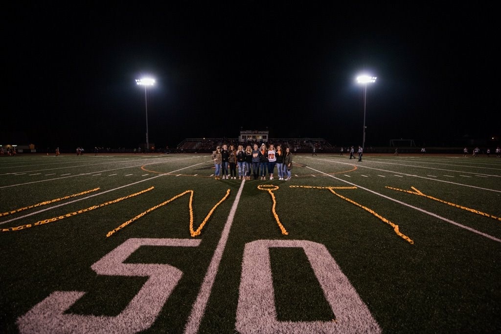 group of students on a football field