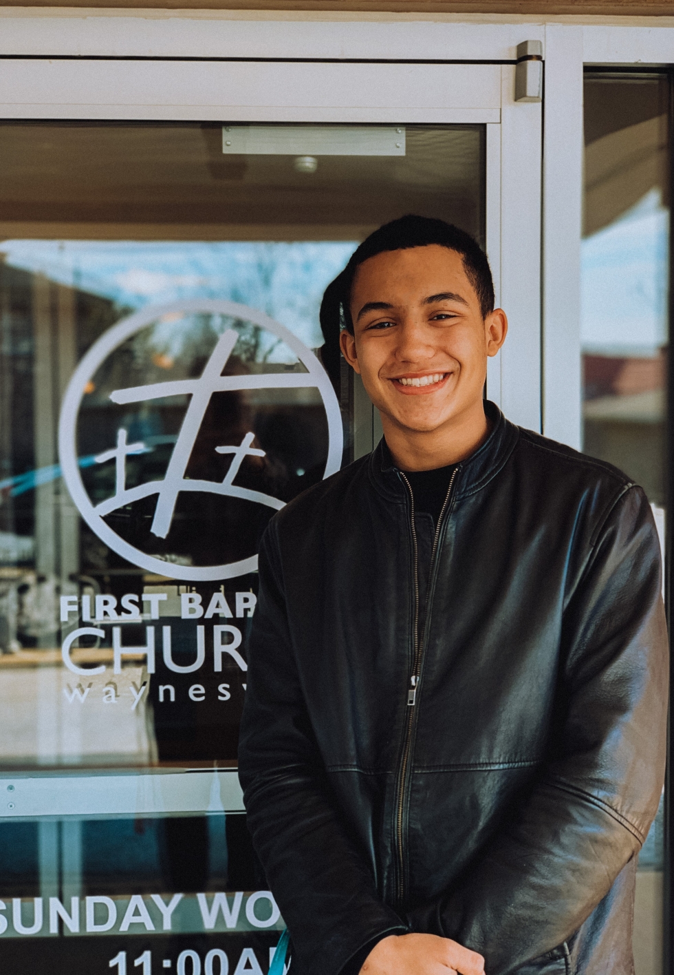 young man wearing leather jacket