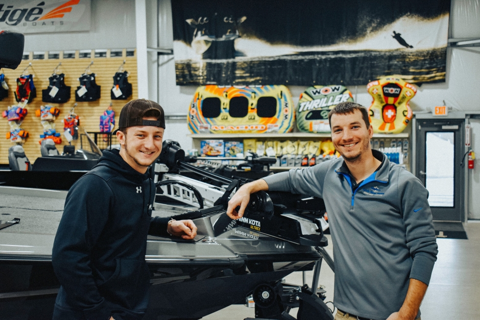 two young men in a boat store